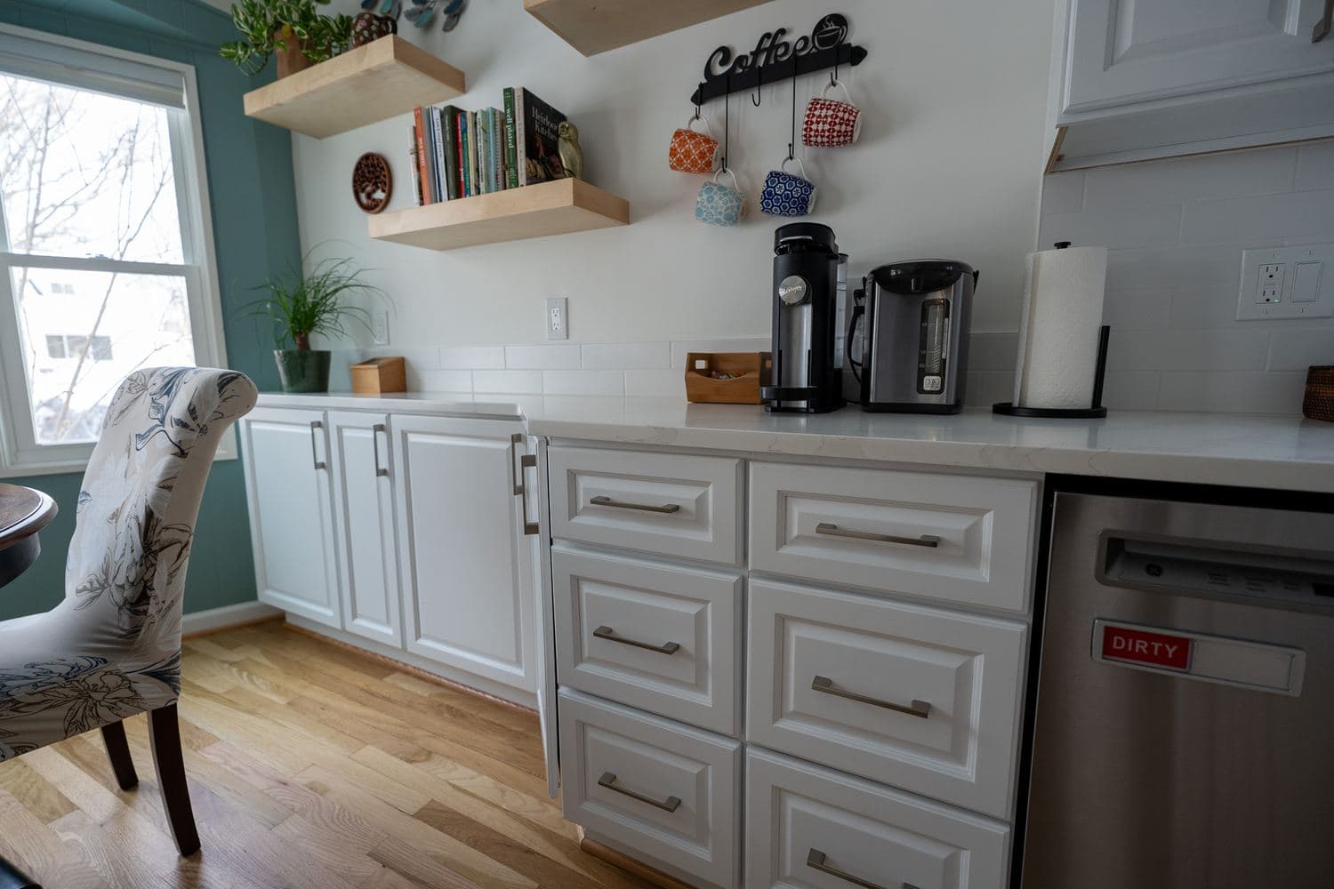 Light kitchen with an island and pendant lights